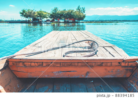 Boat Traveling in Lake heading to the shore front view with no people in Phayao Thailand Boat Traveling in Lake heading to the shore front view with no people in Phayao Thailand 88394185