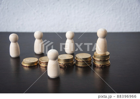 Coins Stack with wooden doll model background - Business and Financial Concept 88396966