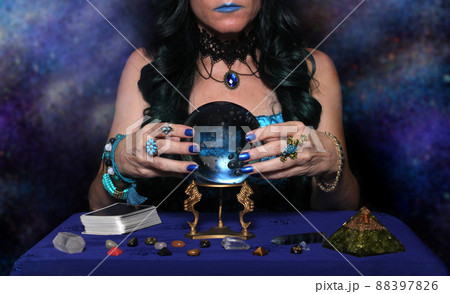 Psychic with crystal ball and tarot cards, Shallow DOF 88397826