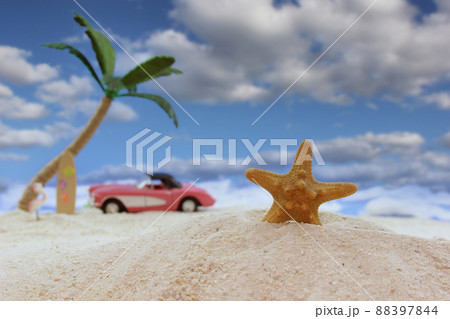 Seashell on Tropical Beach With Vintage Hot Rod in Background and Blue Sky 88397844