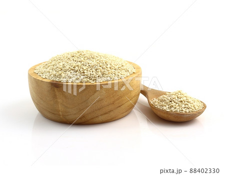 Close up - bowl of white sesame seeds on white background 88402330