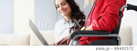 Smiling brunette woman on sofa 88402572