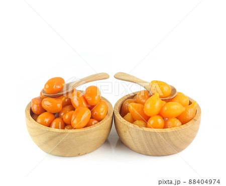 Two kinds of Thai ancient dessert - Egg yolk fudge balls cooked in syrup and gold egg yolks dropi isolated on white background Two kinds of Thai ancient dessert - Egg yolk fudge balls cooked in syrup and gold egg yolks dropi isolated on white background 88404974