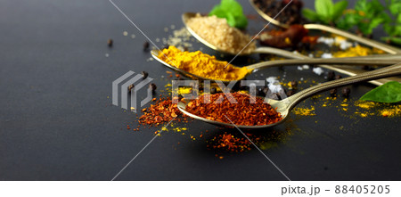 Dry chilli - spicy herbs for cooking and herbs on black background with space 88405205