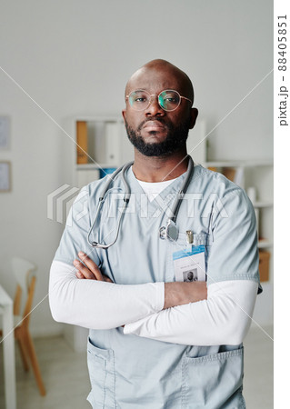 Serious young African American male clinician with phonendoscope on his neck Serious young African American male clinician with phonendoscope on his neck 88405851