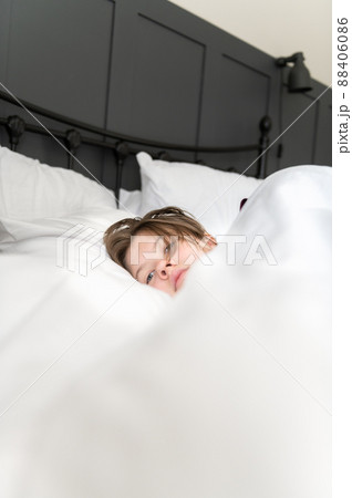 Sleepy teenager girl in bed Sleepy teenager girl in bed 88406086
