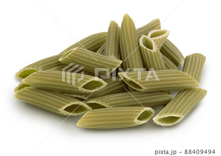 Green pea penne pasta isolated on white background with clipping path. Organic food speciality. Gluten free 88409494