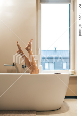 Caucasian female taking a bath in the morning Caucasian female taking a bath in the morning 88411128