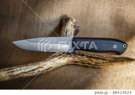 hunting knife handmade on a brown background hunting knife handmade on a brown background 88413624