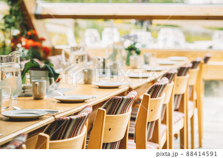 Cozy Interior Of Summer Cafe. Jug Of Water On Table And Cutlery Laid Out 88414591
