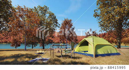 紅葉が美しい秋の湖畔のキャンプサイト / 秋の行楽・ソロキャンプ・ワーケーションのイメージ 88415995