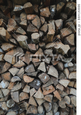 Close up stack of dry firewood oak wooden logs, chopped, split and organized in a pile for winter fuel stock 88416886