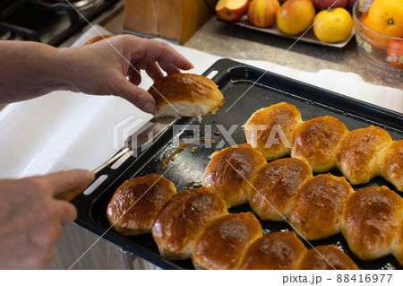 Woman baking pies at home. Pies just from oven. 88416977