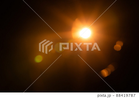 Solar lens flare on black background 88419787