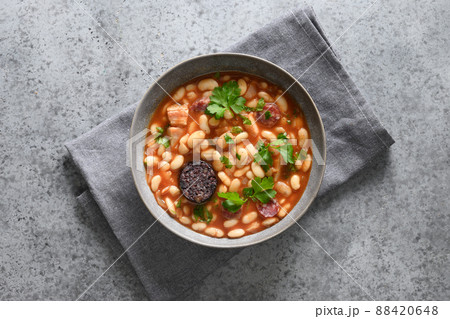 Spanish asturiana fabada stew on gray table. Spanish asturiana fabada stew on gray table. 88420648