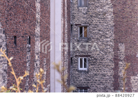 Windows in an old large Parisian brick building 88420927