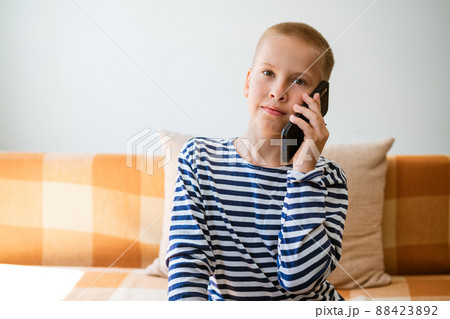 Happy little boy having fun playing game on mobile phone, preschool child 88423892