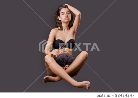 Girl in shorts sticks out them lavender like pubic hair. Symbol stubble Girl in shorts sticks out them lavender like pubic hair. Symbol stubble 88424247