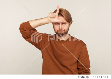 Portrait of emotional bearded man on gray background. 88431284