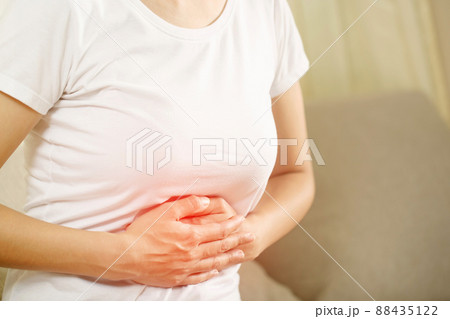 Woman having a stomachache, or menstruation pain. suffering from abdominal. Menstrual cramps. Healthcare and medical, gynecology concept. Woman having a stomachache, or menstruation pain. suffering from abdominal. Menstrual cramps. Healthcare and medical, gynecology concept. 88435122