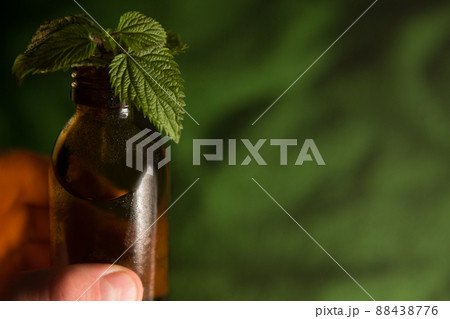 Herbalist Homeopath, space for text. Aromatherapy essential oil, brown bottle. 88438776