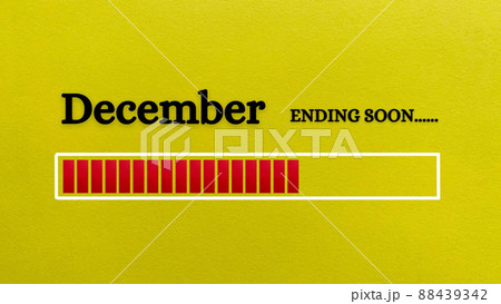 Top view of loading bar showing the end of December month with yellow paper background. 88439342
