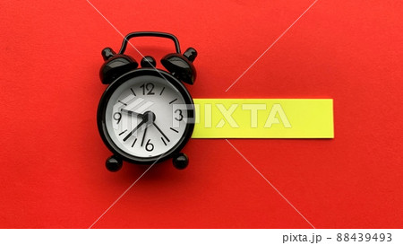 Alarm clock on red background. Time concept. Alarm clock on red background. Time concept. 88439493