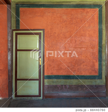 Colorful painted wall and green wooden door, Cairo, Egypt 88440760