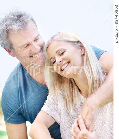 Embracing his lovely wife. An affectionate mature couple enjoying a day in the park together. 88440803
