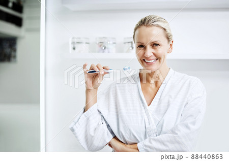 After all these years brushing is still important. Cropped shot of a mature woman posing with a toothbrush. 88440863