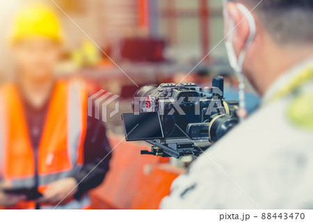 Camera man recording Video footage with professional Mirrorless camera with Gimbal stabilizer. Camera man recording Video footage with professional Mirrorless camera with Gimbal stabilizer. 88443470