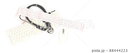 Flatlay arrangement. A stethoscope with an electrocardiogram sheet lying near a computer mouse and keyboard, isolated on a white background. Place to copy paste. Flatlay arrangement. A stethoscope with an electrocardiogram sheet lying near a computer mouse and keyboard, isolated on a white background. Place to copy paste. 88444223