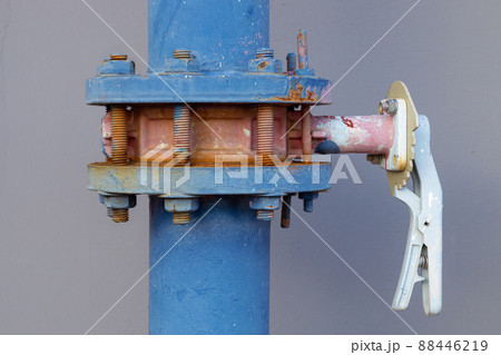closeup water pipes of industry building watering system at roof top outdoor pipe valve with handle lock. closeup water pipes of industry building watering system at roof top outdoor pipe valve with handle lock. 88446219