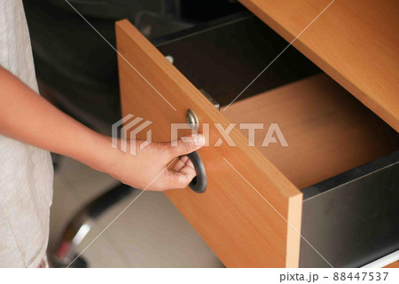 man's hand open drawer wooden in cabinet man's hand open drawer wooden in cabinet 88447537