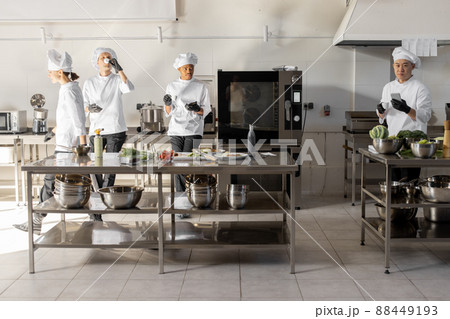 Group of cooks during a coffee break in the restaurant kitchen 88449193