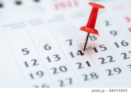 Red push pin on calendar 14th day of the month, mark the Event day with a Pin. Pin on calendar day fourteen, date number 14. Fourteenth day of the month is marked with a red thumbtack Red push pin on calendar 14th day of the month, mark the Event day with a Pin. Pin on calendar day fourteen, date number 14. Fourteenth day of the month is marked with a red thumbtack 88454805