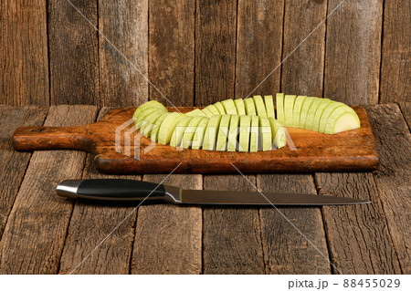 Chopped and sliced zucchini on wooden plank 88455029