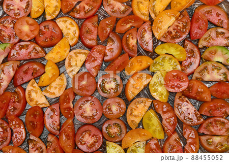 Slice tomato on black background 88455052