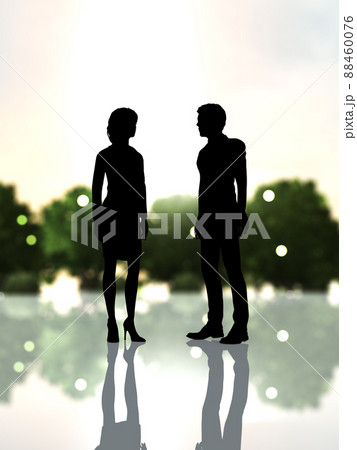 互いに見つめ合うスーツ姿男女の黒いシルエット縦 88460076