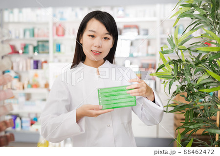 Portrait of chinese female pharmacist is standing with medicines in pharmacy Portrait of chinese female pharmacist is standing with medicines in pharmacy 88462472