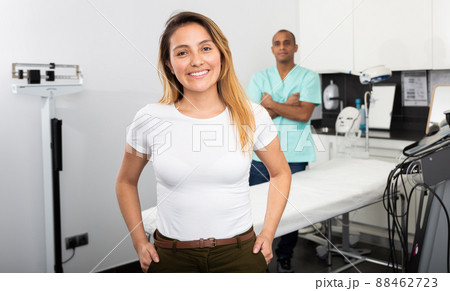 Happy woman client of professional esthetician after procedures 88462723