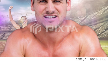 Close up of caucasian fit man against caucasian female athlete winning a race on sports track 88463529