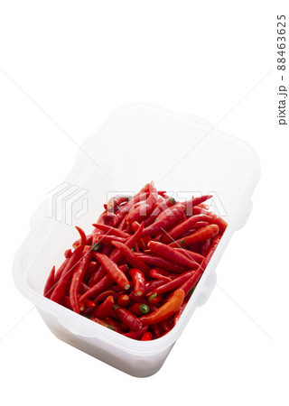 Red chili in plastic container isolated on white Red chili in plastic container isolated on white 88463625