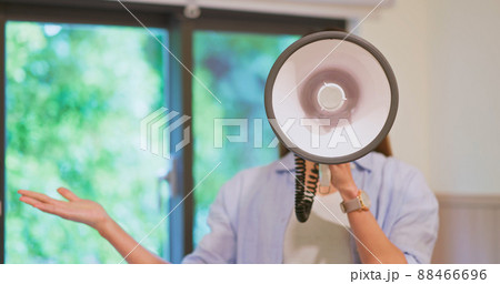 Woman with megaphone 88466696