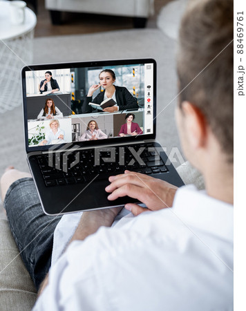 Web conference. Group video chat. Global telecommuting. Business man using laptop to cooperate with female colleagues online on screen in digital office. 88469761