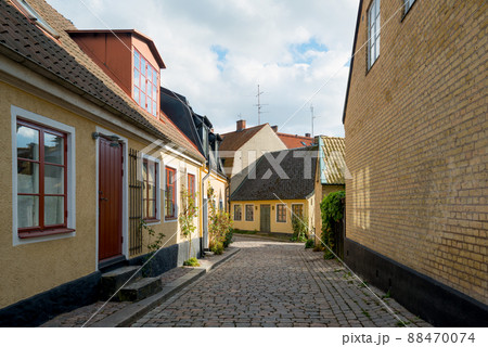 Colorful houses in cobblestone street in the Lund city center, Sweden. Colorful houses in cobblestone street in the Lund city center, Sweden. 88470074