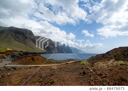 Los Gigantes rocks view near Punta de Teno. Wooden walking path. Ocean Cliffs. West Tenerife, Canary Islands, Spain. Los Gigantes rocks view near Punta de Teno. Wooden walking path. Ocean Cliffs. West Tenerife, Canary Islands, Spain. 88470075