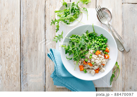 Barley porridge with green peas, baked pumpkin and fresh arugula salad 88470097