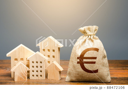 Houses and euro money bag. Investments in real estate and construction industry. Energy efficiency and costs for heating and home services. Community municipal budget. Houses and euro money bag. Investments in real estate and construction industry. Energy efficiency and costs for heating and home services. Community municipal budget. 88472106