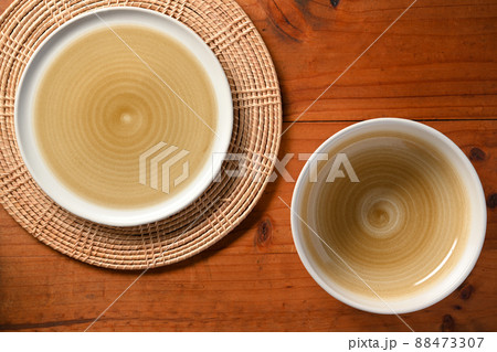 Kitchenware, Empty minimalist ceramic plate and bowl on wooden background. Kitchenware, Empty minimalist ceramic plate and bowl on wooden background. 88473307